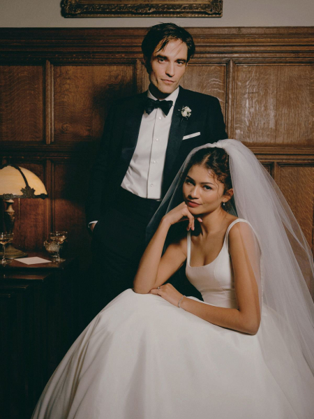 Robert Pattinson and Zendaya posing for the camera in wedding attire in a still from the film The Drama.
