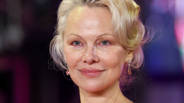 Pamela Anderson’s Feathery Layers Are a Trip to the ’70s—See the Photos